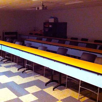 Figure 7 shows a classroom with two long desks facing the front of the room which is a less than ideal configuration